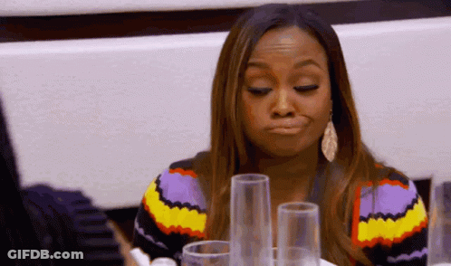 Woman In Colorful Sweater And Glasses Making Funny Face GIF