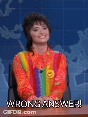 Woman In Colorful Sweater At Desk With Wrong Answer GIF