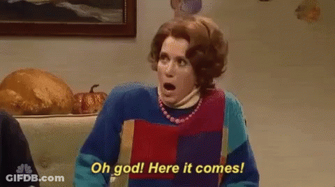 Woman In Colorful Sweater Surprised GIF