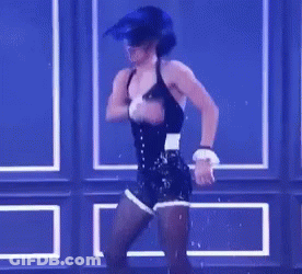 Woman In Corset And Shorts Dancing On Stage GIF