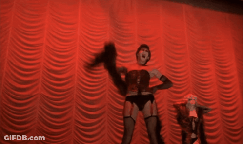 Woman In Corset Dancing On Stage GIF