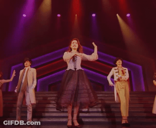 Woman In Corset Dancing With Two Others GIF