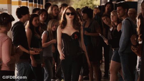 Woman In Corset With Letter A In Front Of Crowd GIF