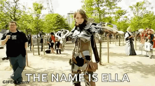 Woman In Cosplay With Man Taking Photo In Park GIF