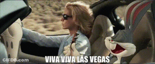 Woman In Costume Holding Cards GIF
