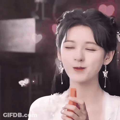 Woman In Costume Holding Carrot GIF
