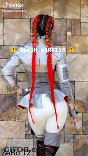 Woman In Costume With Red Braids GIF