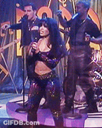 Woman In Cow Print Crop Top Dancing On Stage GIF