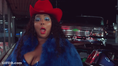 Woman In Cowboy Hat And Blue Fur Coat GIF