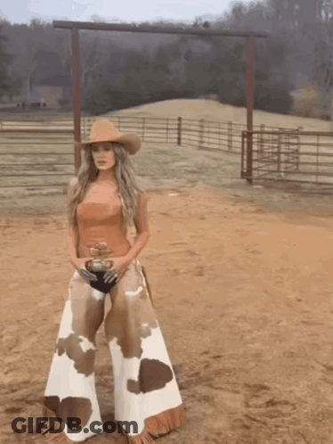 Woman In Cowboy Hat And Chaps GIF