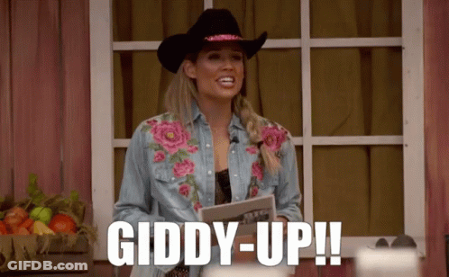 Woman In Cowboy Hat And Denim Shirt Says Giddy Up GIF
