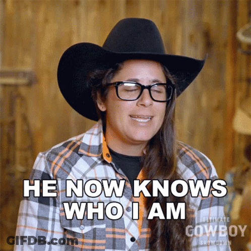 Woman In Cowboy Hat And Plaid Shirt Says I Know Who I Am GIF