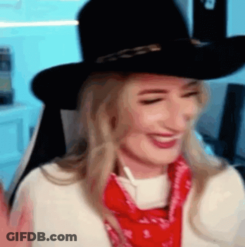 Woman In Cowboy Hat And Red Bandana Smiling GIF