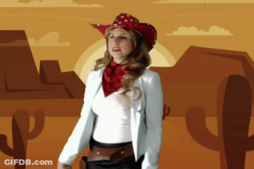 Woman In Cowboy Hat And Scarf In Desert GIF