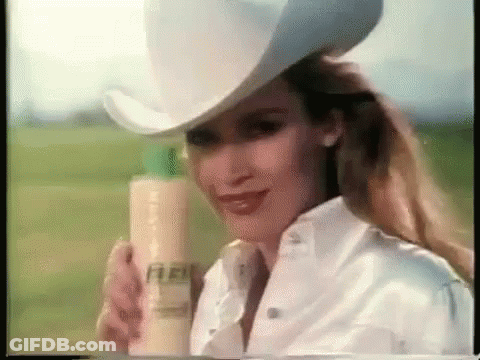 Woman In Cowboy Hat Holding Shampoo GIF