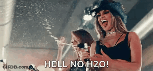 Woman In Cowboy Hat Holding Water Bottle GIF