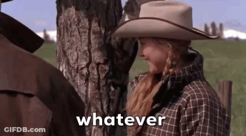 Woman In Cowboy Hat Saying Whatever Next To Man In Field GIF
