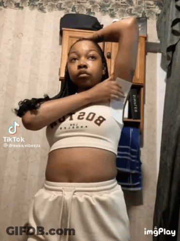Woman In Crop Top 208 Holding Paper GIF