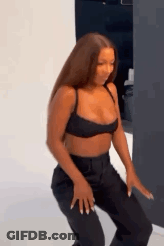 Woman In Crop Top And Black Pants Dancing GIF