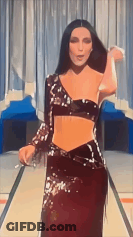 Woman In Crop Top And Long Skirt Dancing On Stage GIF