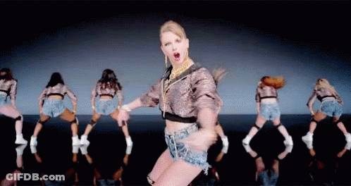 Woman In Crop Top And Shorts Dancing With Dancers GIF