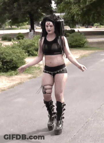 Woman In Crop Top And Shorts Walking GIF