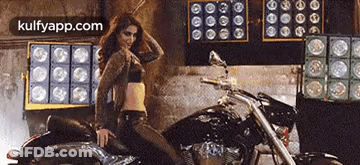 Woman In Crop Top Dancing On Motorcycle GIF