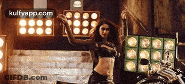 Woman In Crop Top Dancing On Motorcycle GIF