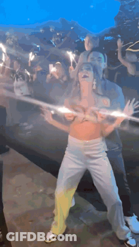 Woman In Crop Top Dancing With Sparklers GIF