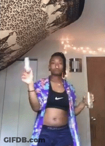 Woman In Crop Top Nike Shorts Holding Wii Remote GIF