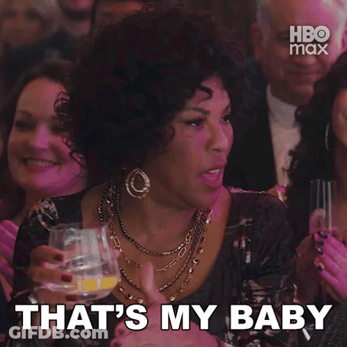 Woman In Crowd Says That's My Baby Holding Glass GIF