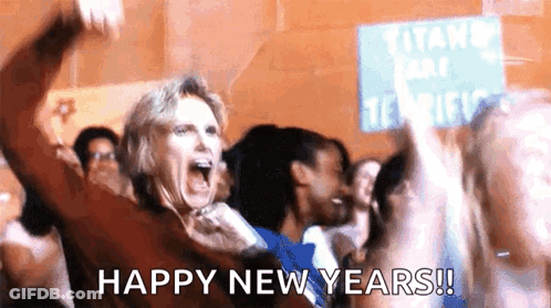 Woman In Crowd Shouts Happy New Years At Titans Park Tennis Sign GIF
