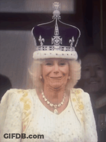 Woman In Crown And Pearls Smiling GIF