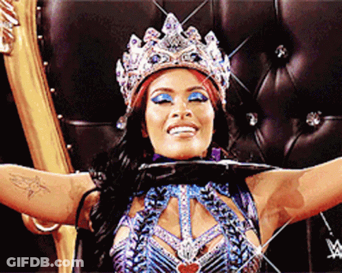 Woman In Crown Sitting With Arms Outstretched GIF