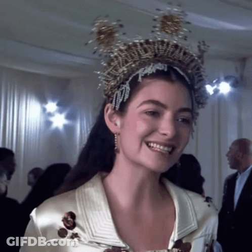 Woman In Crown Smiling At Camera GIF
