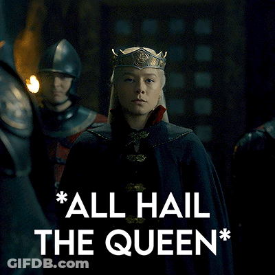 Woman In Crown Standing Next To Man In Helmet GIF
