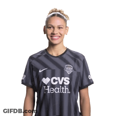 Woman In CVS Health Shirt Smiling With Hands Folded GIF