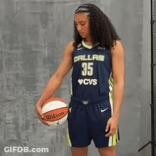 Woman In Dallas 35 Jersey Holding Wilson Basketball GIF