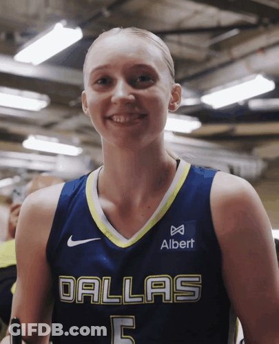 Woman In Dallas Basketball Jersey Smiling GIF