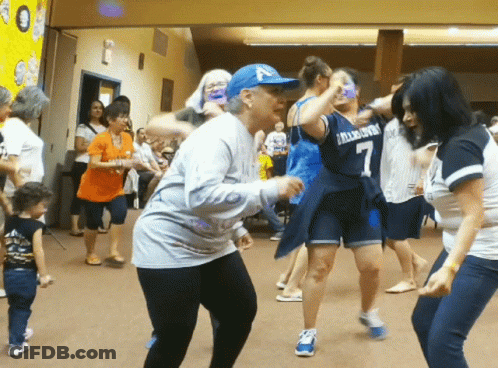 Woman In Dallas Cowboys Jersey Dancing With Others GIF