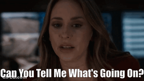 Woman In Dark Room Asking What's Going On GIF