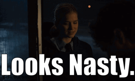 Woman In Dark Room Looks Nasty GIF