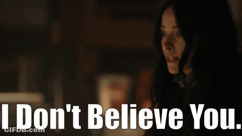 Woman In Dark Room Saying I Don't Believe You GIF