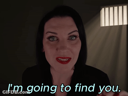 Woman In Dark Room Saying I'm Going To Find You GIF