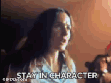 Woman In Dark Room Saying Stay In Character GIF
