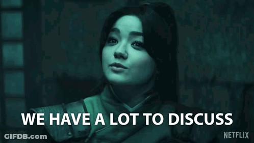 Woman In Dark Room Saying We Have A Lot To Discuss GIF