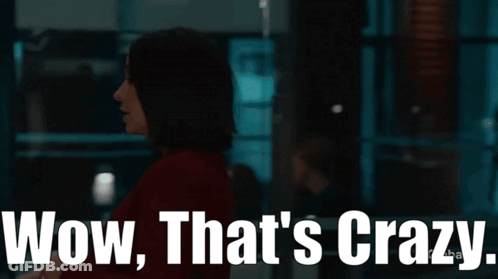 Woman In Dark Room Saying Wow That's Crazy GIF