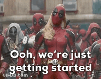 Woman In Deadpool Costume Standing In Crowd Of Deadpools GIF