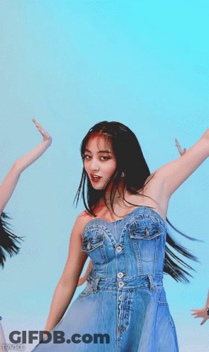 Woman In Denim Dress Dancing In Blue Sky GIF