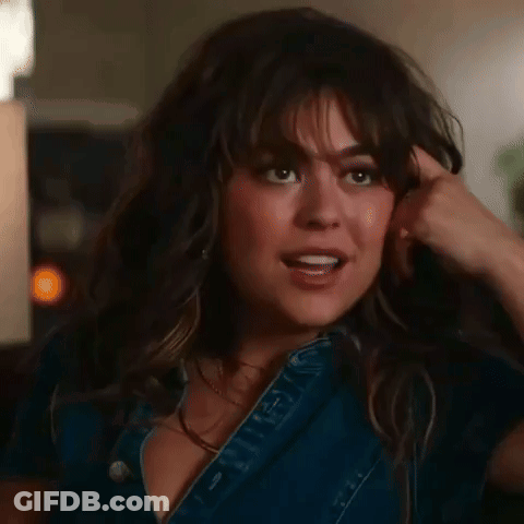 Woman In Denim Dress Holding Hair GIF